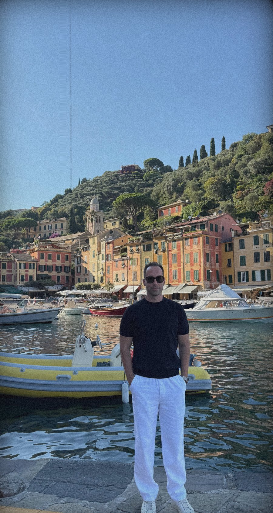 Mert Tolay standing at a harbour